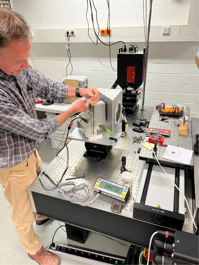 NIST scientist Paul Williams aligns the RPPM to the PTB standard, the EC-PM. Because the RPPM is non-absorbing, both detectors measure the same laser beam at the same time.