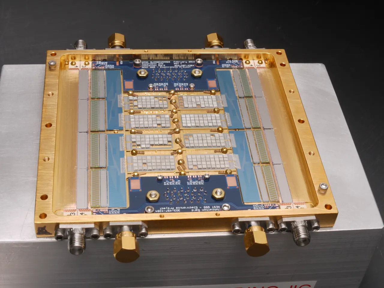 An array of sensors appear as a set of rectangles within a gold-colored metal frame.
