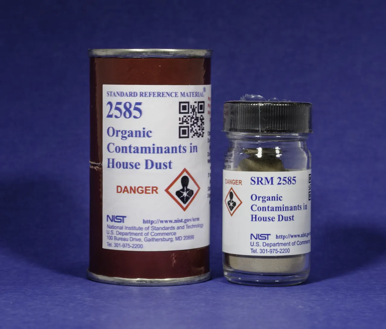 Glass bottle and larger can are both labeled "SRM 2585 Organic Contaminants in House Dust," with a "Danger" notice on the label.